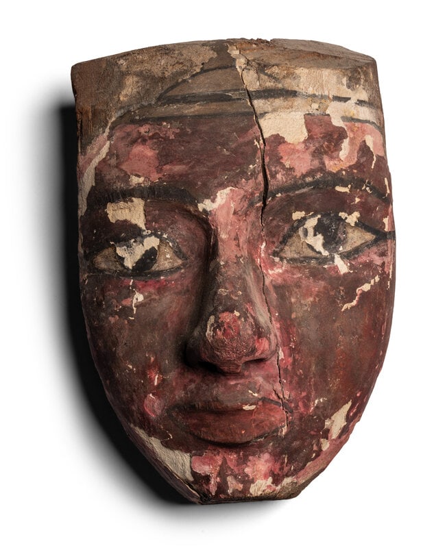 An Egyptian Painted Wood Mummy Mask : An Egyptian Painted Wood Mummy Mask Late Period to Ptolemaic Period, 664-30 B.C. Height 11 3/8 inches (28.89 cm). Size Height 11 3/8 inches (28.89 cm). Provenance Prov