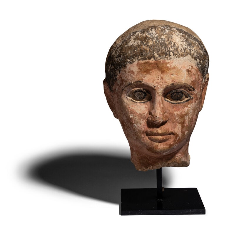 An Egyptian Painted Limestone Head of a Youth (1 of 5)