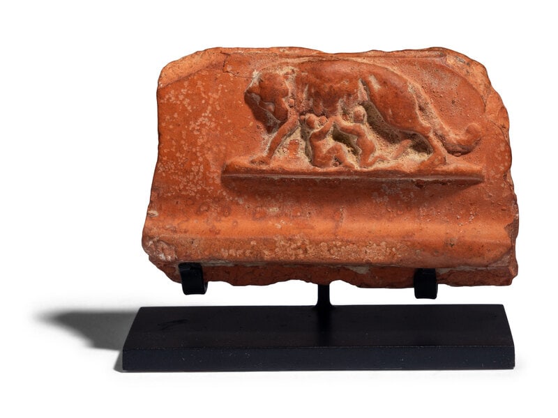 A Roman Redware Fragment with Romulus and Remus: A Roman Redware Fragment with Romulus and Remus Circa 3rd Century A.D. Width 3 1/8 inches (7.94 cm). Size Width 3 1/8 inches (7.94 cm). Condition Height with stand 2 1/2 inc