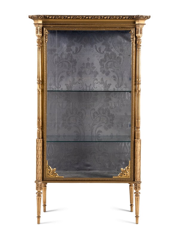 A Giltwood Vitrine Cabinet: A Giltwood Vitrine Cabinet Late 19th/Early 20th Century Height 64 1/2 x width 37 1/2 x depth 17 inches. This lot is located in Chicago. Condition On side of th