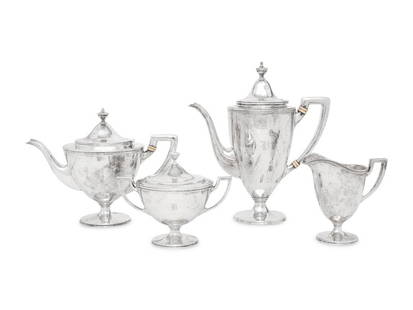 A Tiffany and Co. Silver Tea and Coffee Service: A Tiffany and Co. Silver Tea and Coffee Service New York, Circa 1910comprising a teapot, a coffee pot, a creamer and a covered sugar, each with B monogram marked 'Sterling' to underside 73 ozt 12
