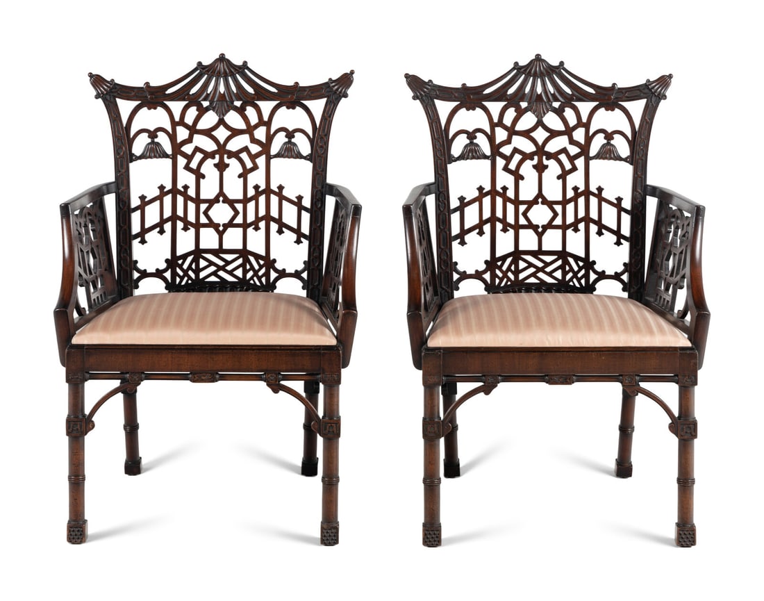 A Pair of George III Style Pierce-Carved Mahogany Armchairs: A Pair of George III Style Pierce-Carved Mahogany Armchairs Late 19th Century in the "Chinese Chippendale" taste. Height 39 x width 22 1/2 x depth 18 1/2 inches. This lot is located in Chicago. Proper