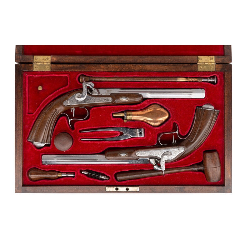 Pair of Reproduction Lepage Dueling Percussion Pistols in Case: Pair of Reproduction Lepage Dueling Percussion Pistols in Case .44 Caliber. 10.75" barrel length. SN: NSN. Polished bright finish overall with scrollwork embellishments to all parts, an octagonal barr