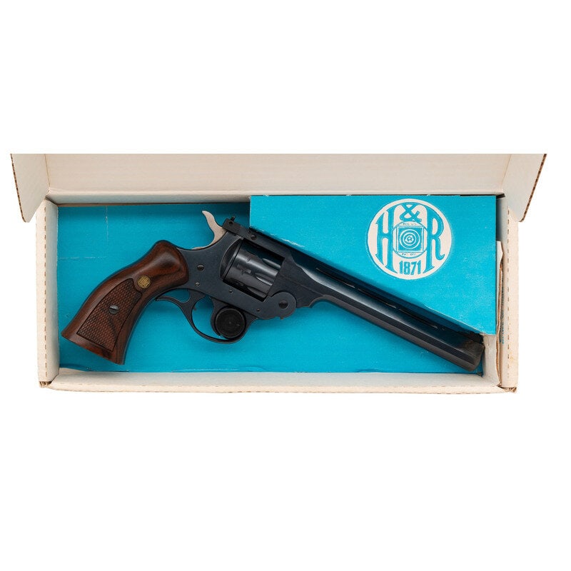 *Harrington & Richardson Model 999 Sportsman in Box with Manual: *Harrington & Richardson Model 999 Sportsman in Box with Manual .22 LR. 6" barrel length. SN: AY123619. Blued metal finish overall with hammer left in the white mounting Harrington & Richardso