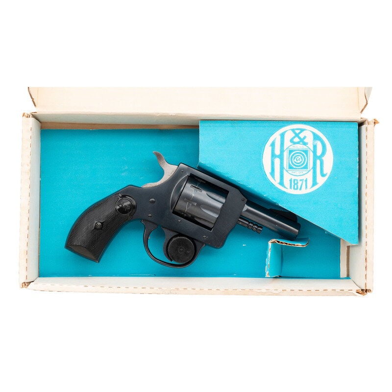*Harrington & Richardson Model 929 in Box: *Harrington & Richardson Model 929 in Box .22 LR. 2.5" barrel length. SN: AU024231. Blued metal finish with hammer in the white and mounting black synthetic H&R logo grips. Double action hand 