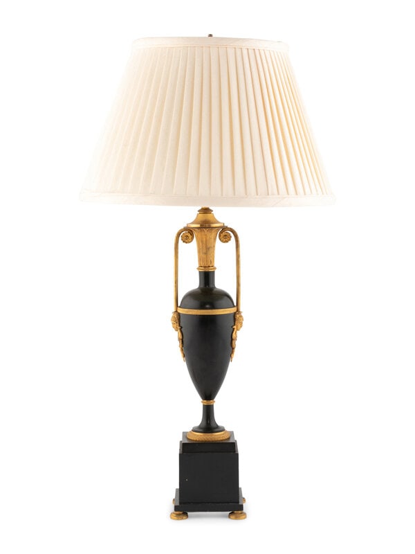 A Continental Neoclassical Gilt Bronze and Black Tole Urn : A Continental Neoclassical Gilt Bronze and Black Tole Urn Late 19th Century mounted as a lamp with a pleated shade. Height to top of shade 28 inches. This lot is located in Chicago.</