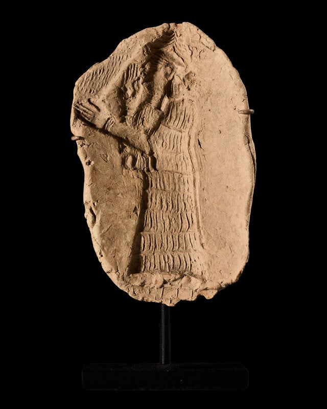 A Sumerian Clay Mold of a Priest: A Sumerian Clay Mold of a Priest Circa Late 2nd-Early 1st Millennium B.C. Height 4 3/8 inches (11.11 cm). This lot is located in Chicago. Size Height 4 3/8 inches