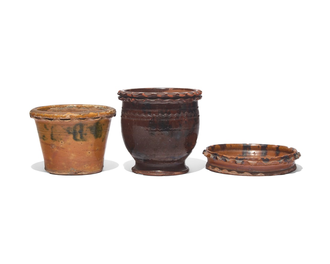 Two Glazed and Incised Redware Flower Pots and a Flower Pot Saucer, Willoughby Smith, Womelsdorf,: Two Glazed and Incised Redware Flower Pots and a Flower Pot Saucer, Willoughby Smith, Womelsdorf, Pennsylvania, and Others, Late 19th Century Variously glazed, each with ruffled rim, the urn-form pot