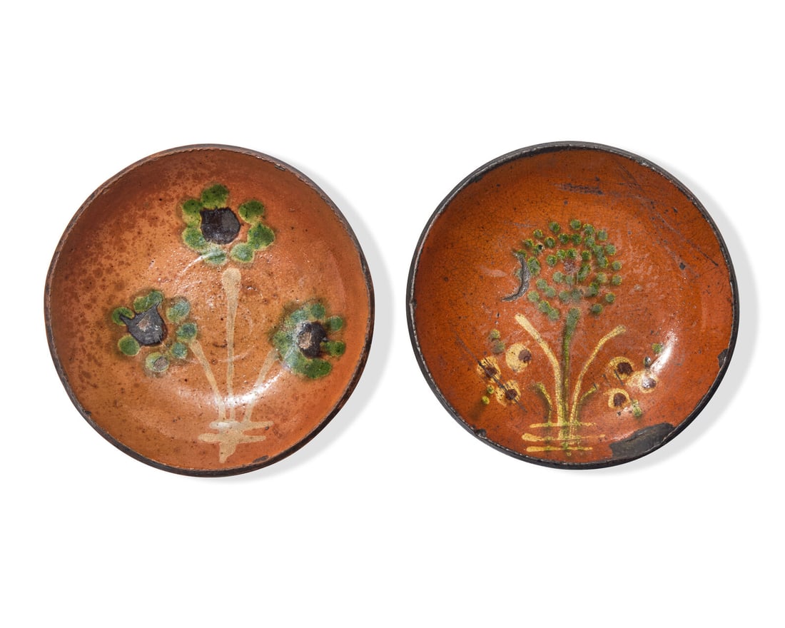 Two Small Glazed and Floral Slip-Decorated Redware Plates, Pennsylvania, 19th Century: Two Small Glazed and Floral Slip-Decorated Redware Plates, Pennsylvania, 19th Century Pennsylvania, late 19th century Both decorated with green, yellow and brown slip. Dia: 6 3/4 in. This lot is locat