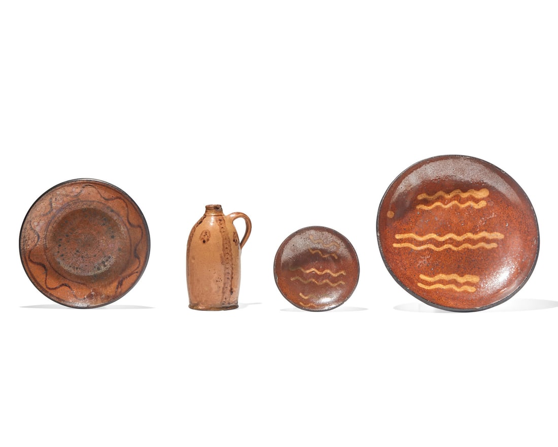 Three Glazed Redware Plates and a Small Glazed Redware Jug, 19th Century: Three Glazed Redware Plates and a Small Glazed Redware Jug, 19th Century The three slip-decorated plates, the jug / bottle decorated with brown-slip striping and green and brown slip dots. Dia: 9 in.