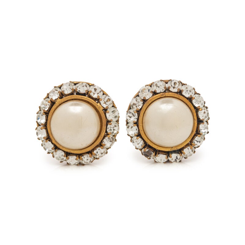 Chanel Faux Pearl Ear Clips: Chanel Faux Pearl Ear Clips Circular gold-tone metal ear clips set with faux-pearl in center and strass around perimeter. Label (stamped): Chanel Date: Late 20th Century Approximate Meas