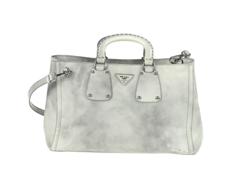 Prada Spazzolato Handbag : Prada Spazzolato Handbag Prada Tote Bag in Grey Spazzolato Leather with Silver-Tone Hardware. Label: Prada Country of Origin: Italy Detailed Features 17" W x 9.5" H x 8.5" D