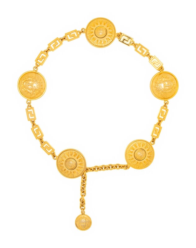 Gianni Versace Medusa Chain Belt, 1990s : Gianni Versace Medusa Chain Belt, 1990s Chain belt in gold-tone metal with Medusa head and sun medallions. Label: Gianni Versace Approximate Measurements: Belt-able length: 30"