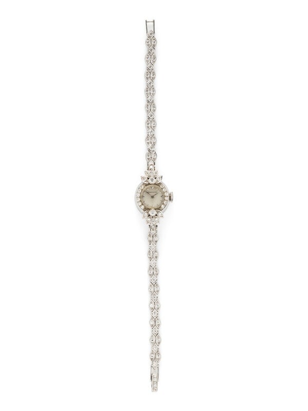H.W. BEATTIE & SONS, WHITE GOLD AND DIAMOND WATCH: H.W. BEATTIE & SONS, WHITE GOLD AND DIAMOND WATCH Maker: H.W. Beattie & Sons Case size: Approx. 16 mm Case material: 14K white gold Bezel: