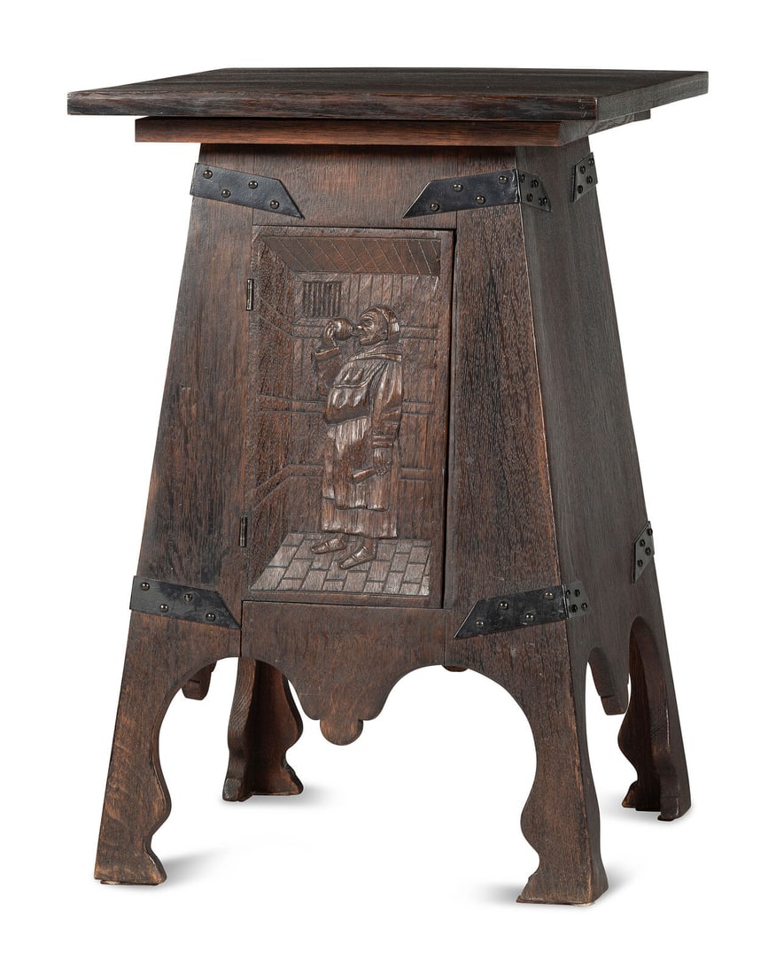 An Arts and Crafts Carved Oak Wine Cellarette: An Arts and Crafts Carved Oak Wine Cellarette Early 20th Century the door inset with a figural panel. incised maker's mark, lid interior Height 29 3/4 x width 20 x depth 20 inches. Provenance: Given t