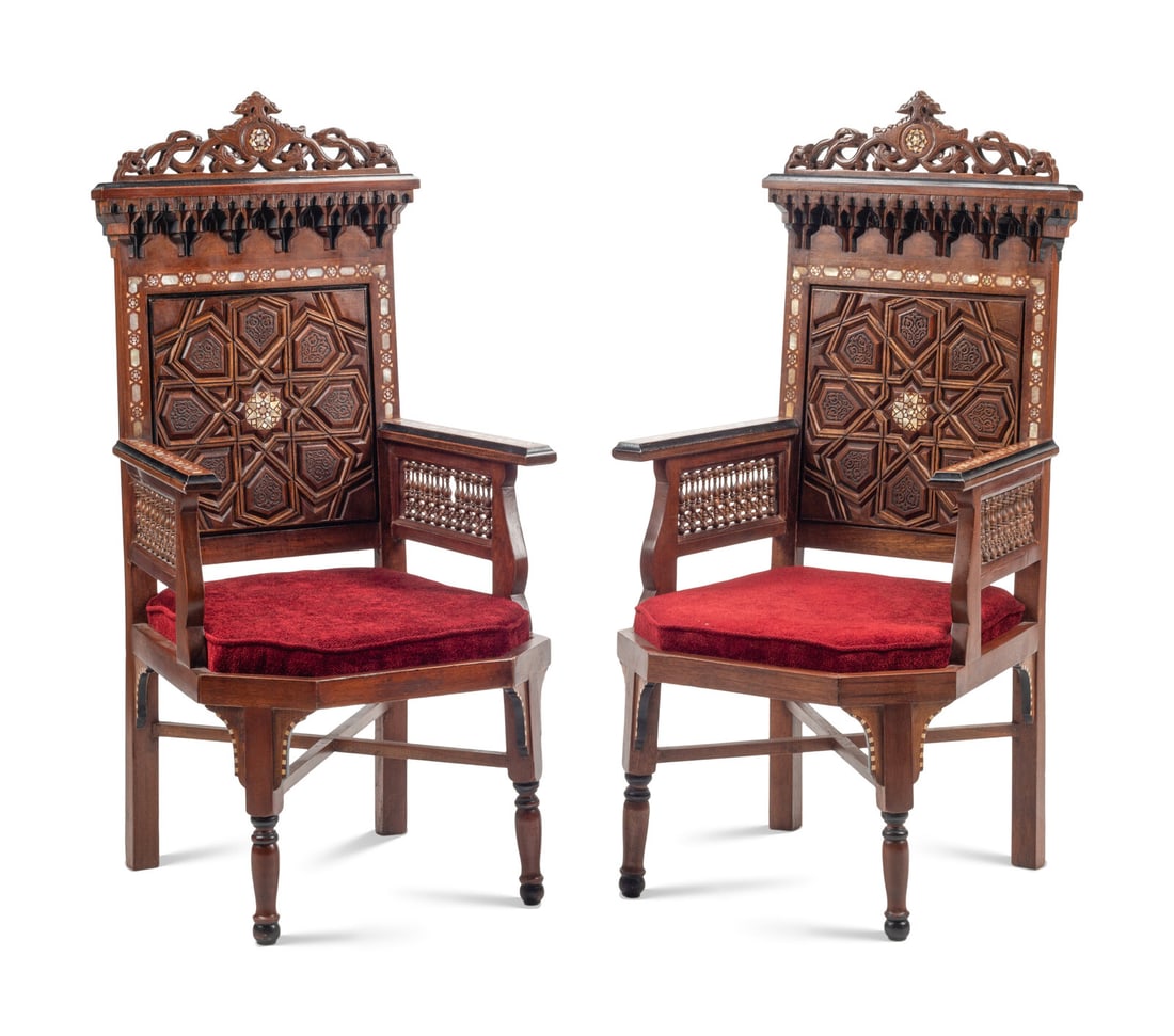 A Pair of Moorish Style Mother-of-Pearl Inlaid Walnut Armchairs: A Pair of Moorish Style Mother-of-Pearl Inlaid Walnut Armchairs 20th Century Height 49 1/2 x width 24 1/4 x depth 25 inches. This lot is located in Chicago.