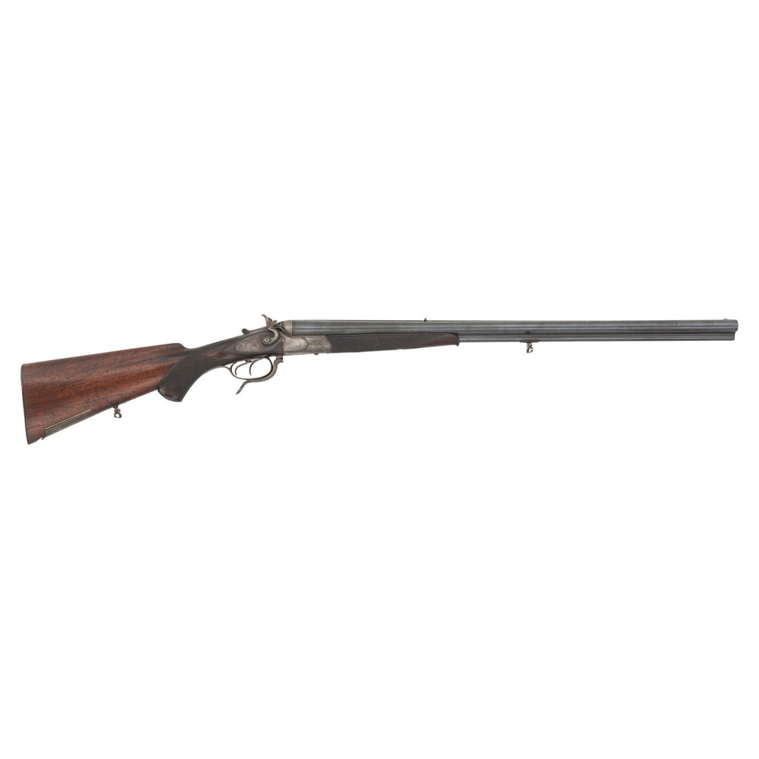 **Drilling Rifle Marked Leopold Saemann of Gorlitz: **Drilling Rifle Marked Leopold Saemann of Gorlitz 8.7mm/16 Gauge. 26.5" barrel length. SN: 15058. 2.675" chamber length. Full Choke left. Modified Choke right. Case colored finish with blued barrels 