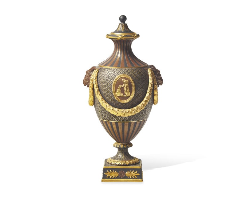 A Wedgwood Brown Glazed and Parcel Gilt Black Basalt Covered Urn: A Wedgwood Brown Glazed and Parcel Gilt Black Basalt Covered Urn 19th Century impressed Wedgwood to underside. Height 9 1/2 inches. Property from the Collection of Dr. Ellis