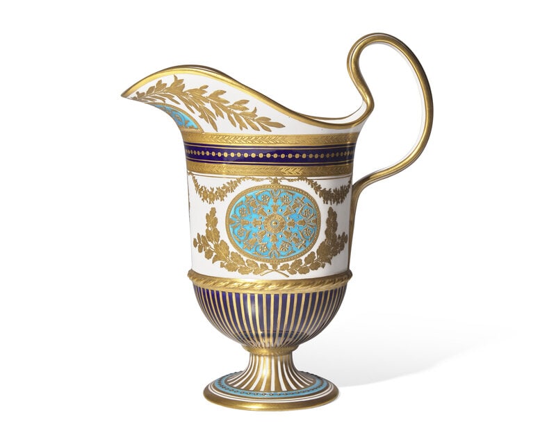 A Wedgwood Parcel Gilt Porcelain Pitcher: A Wedgwood Parcel Gilt Porcelain Pitcher Circa 1900 in the neoclassical style with laurel sprays and cobalt bands stripes and turquoise medallions, marked WEDGWOOD in iron red to the underside. <