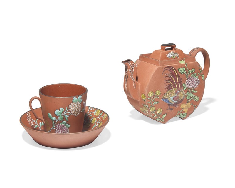 A Wedgwood Rosso Antico Teapot, Cup and Saucer: A Wedgwood Rosso Antico Teapot, Cup and Saucer 19th/20th Century each painted with chrysanthemum and rooster motif; impressed Wedgwood to undersides. Height of teapot 5 inches.