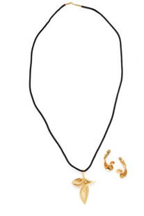 MICHAEL GOOD, YELLOW GOLD NECKLACE AND CLIP EARRINGS: MICHAEL GOOD, YELLOW GOLD NECKLACE AND CLIP EARRINGS Necklace on black cord with yellow gold clasp. 18 karat yellow gold. Necklace: 31 1/4 inches long. Pendant: 2 3/4 inches long. Earrings: 1 5/8 inch