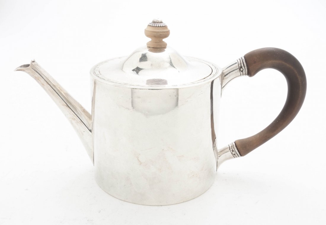 A George III Silver Teapot, John Parker & Edward Wa: A George III Silver Teapot, John Parker & Edward Wakelin, London, 1772, of squat cylindrical form with a wood finial and handle; approximate weight overall 8.77 ozt. Height 4 1/2 inches.