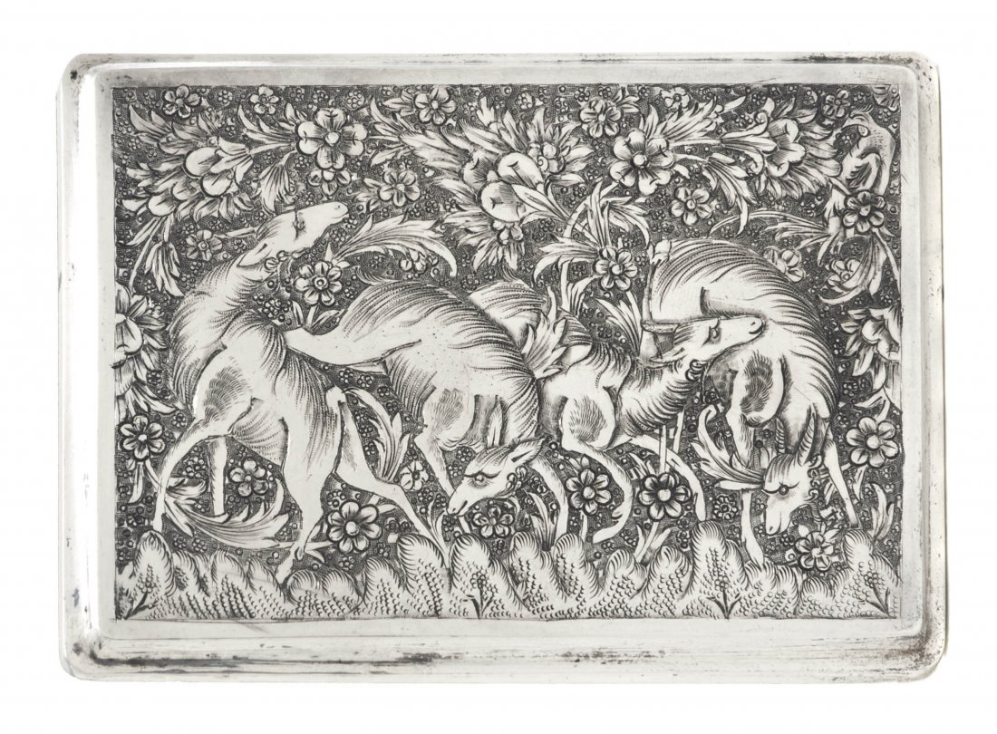 A Middle Eastern Silver Cigarette Case, Width 4 1/: A Middle Eastern Silver Cigarette Case, of rectangular form, having chased decoration, one side depicting four deer feeding, the other side depicting birds amidst foliage, opening to a gilt interior; 