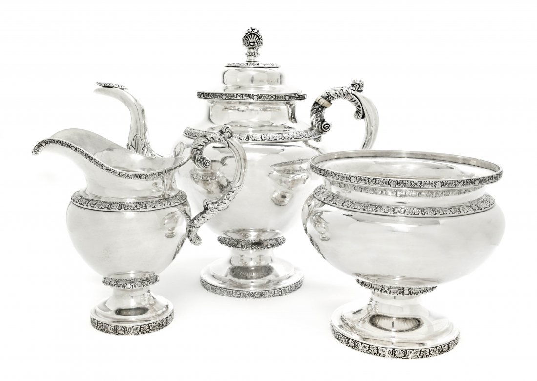 An American Coin Silver Tea Service, John Connor,: An American Coin Silver Tea Service, John Connor, New York, circa 1834, each of baluster form with bands of foliate repousse decoration, comprising a teapot with ivory insulators, a creamer and sugar;