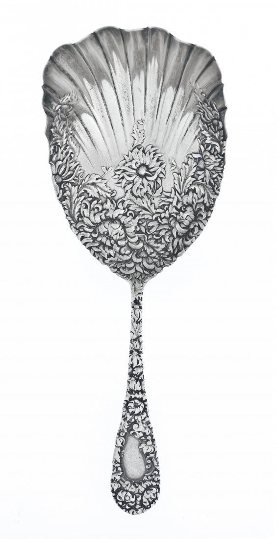 An American Sterling Silver Casserole Server, Durg: An American Sterling Silver Casserole Server, Durgin, retailed by Harris & Shafer, in the Chrysanthemum pattern; approximate weight 4.85 ozt. Length 8 3/8 inches. Property from the Estate of a United