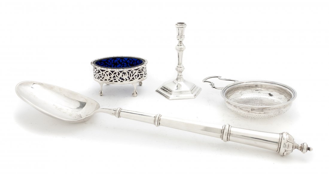 A Collection of English Silver Articles, Length of: A Collection of English Silver Articles, comprising a candlestick by Charles Stewart Harris, London, 1904, a silver salt cellar with a cobalt glass liner, London, 1805, marked IS, a silver strainer, L