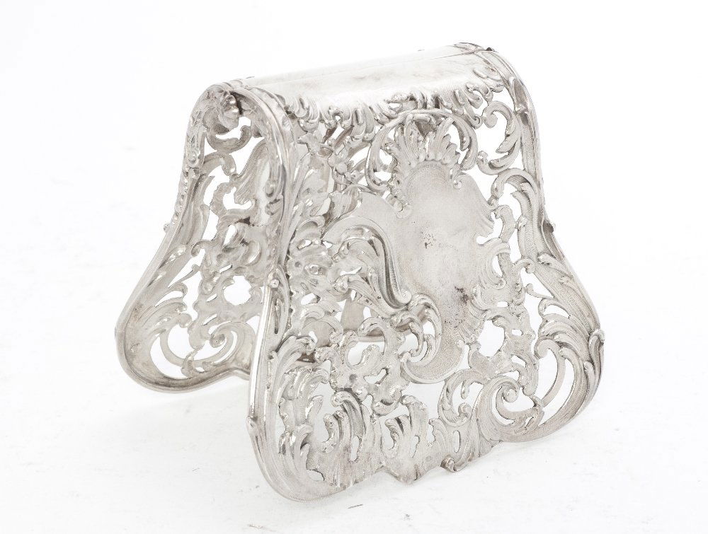 A French Silver Toast Server, Alphonse Debain, Hei: A French Silver Toast Server, Alphonse Debain, the shaped openwork hinged body having scrolling foliate decoration centered by a cartouche; approximate weight 4.37 ozt. Height 2 5/8 inches.