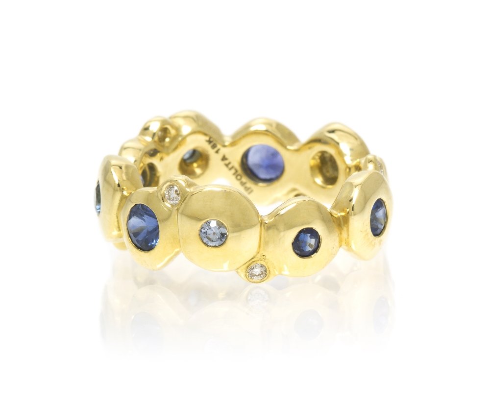 An 18 Karat Yellow Gold, Sapphire and Diamond Ring: An 18 Karat Yellow Gold, Sapphire and Diamond Ring, Ippolita, containing 10 round brilliant cut blue and violet sapphires and six round brilliant cut diamonds weighing approximately 0.11 carat total. 