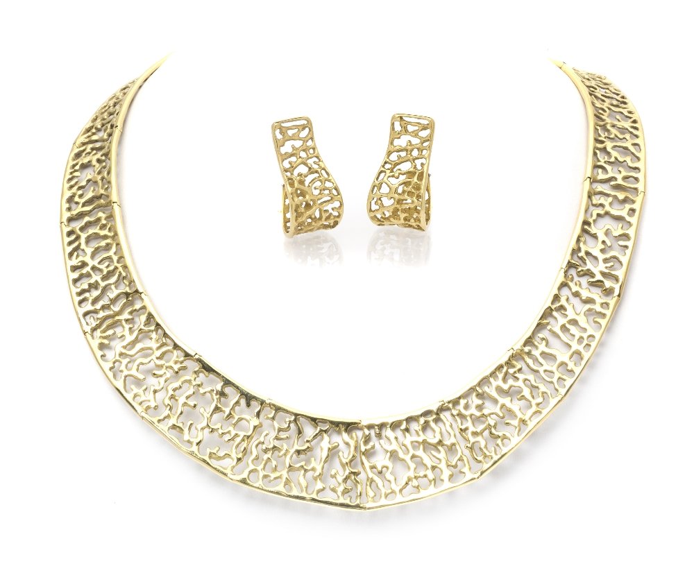 An 18 Karat Yellow Gold Demi Parure, Angela Cummin: An 18 Karat Yellow Gold Demi Parure, Angela Cummings consisting of an openwork organic motif polished gold necklace, together with matching earclips. Stamp: CUMMINGS 1987 18K. 70.90 dwts. Property fro