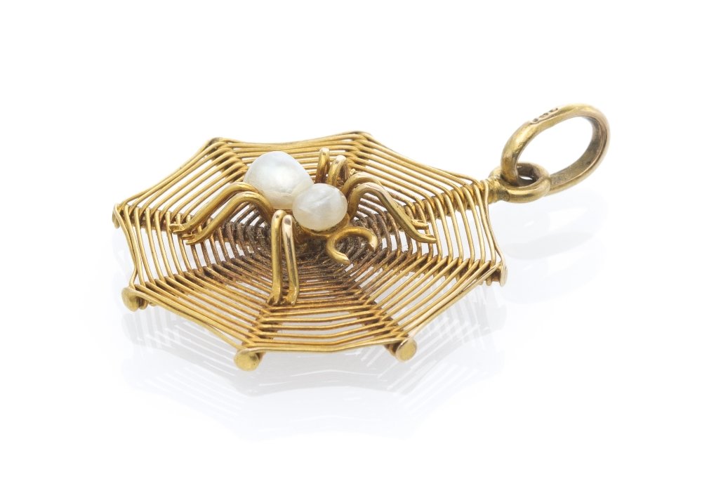 An Antique 18 Karat Yellow Gold and Pearl Spider W: An Antique 18 Karat Yellow Gold and Pearl Spider Web Pendant, in a wirework web design surmounted with a wirework spider containing two baroque pearls (origin not tested). Stamp: 18C. 1.40 dwts.