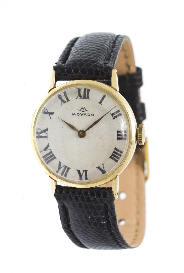 A Vintage 14 Karat Yellow Gold Wristwatch, Movado,: A Vintage 14 Karat Yellow Gold Wristwatch, Movado, 24.00 mm case diameter, white dial, Roman numerals, gilt feuille hands, snap on case back, 17 jewel manual wind mechanical movement, black lizard str
