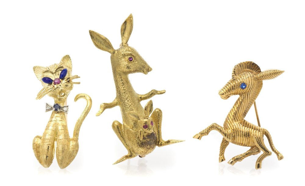 A Collection of Vintage Yellow Gold Animal Brooche: A Collection of Vintage Yellow Gold Animal Brooches, consisting of an 18 karat yellow gold textured cat brooch containing blue enamel eyes, a round brilliant cut ruby nose and a blue sapphire and diam