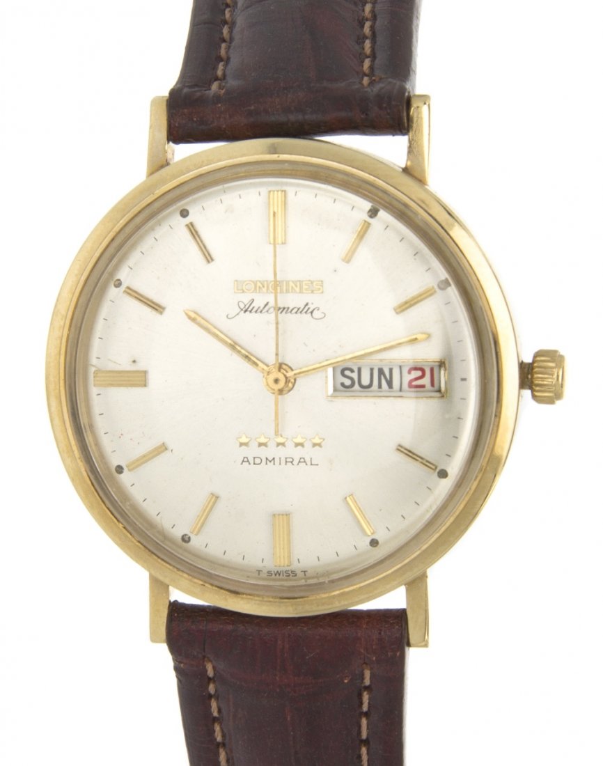A Vintage 14 Karat Yellow Gold Admiral Wristwatch, L: A Vintage 14 Karat Yellow Gold Admiral Wristwatch, Longines, 35.00 mm case diameter, matte silvered dial, applied gilt baton numerals, gilt baton hands, center sweep seconds, day/date aperture at 3 o'