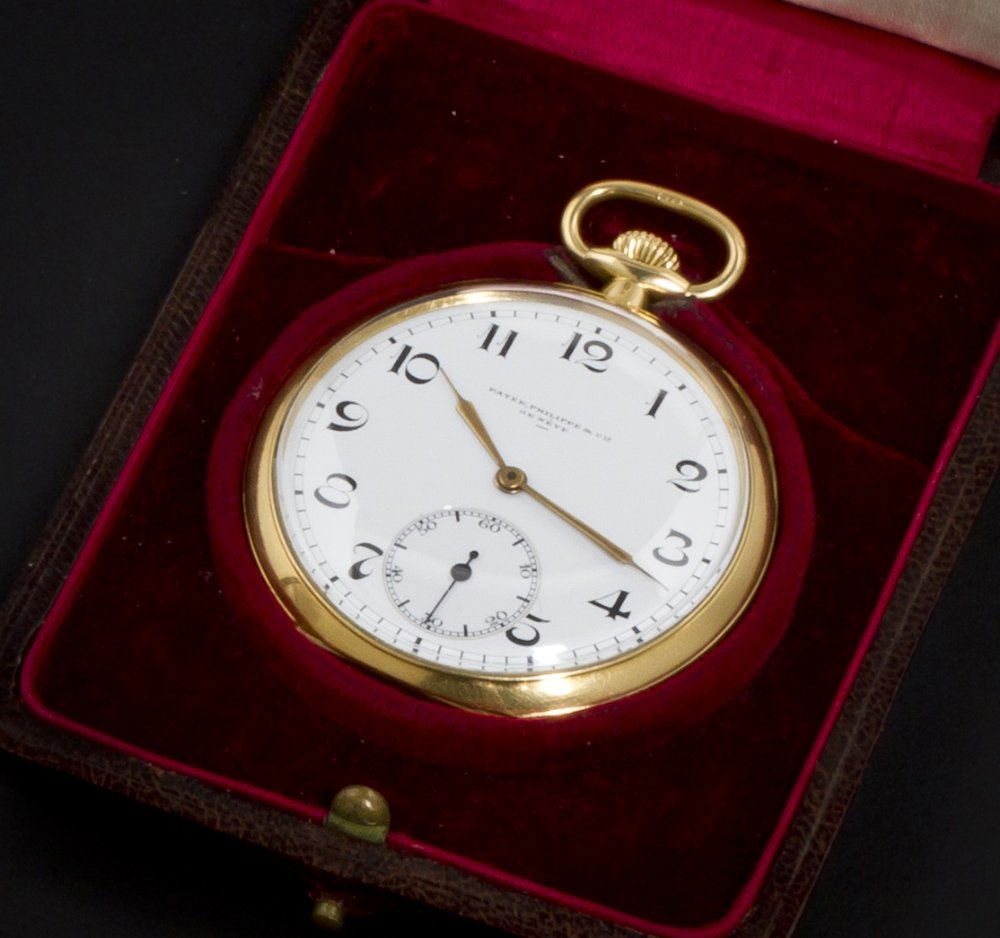 An 18 Karat Yellow Gold Open Face Pocket Watch, Pat: An 18 Karat Yellow Gold Open Face Pocket Watch, Patek Philippe, Circa 1920, 50.00 mm case diameter, white porcelain dial, Arabic numerals, gold index hands, subdial for seconds at 6 o'clock, polished