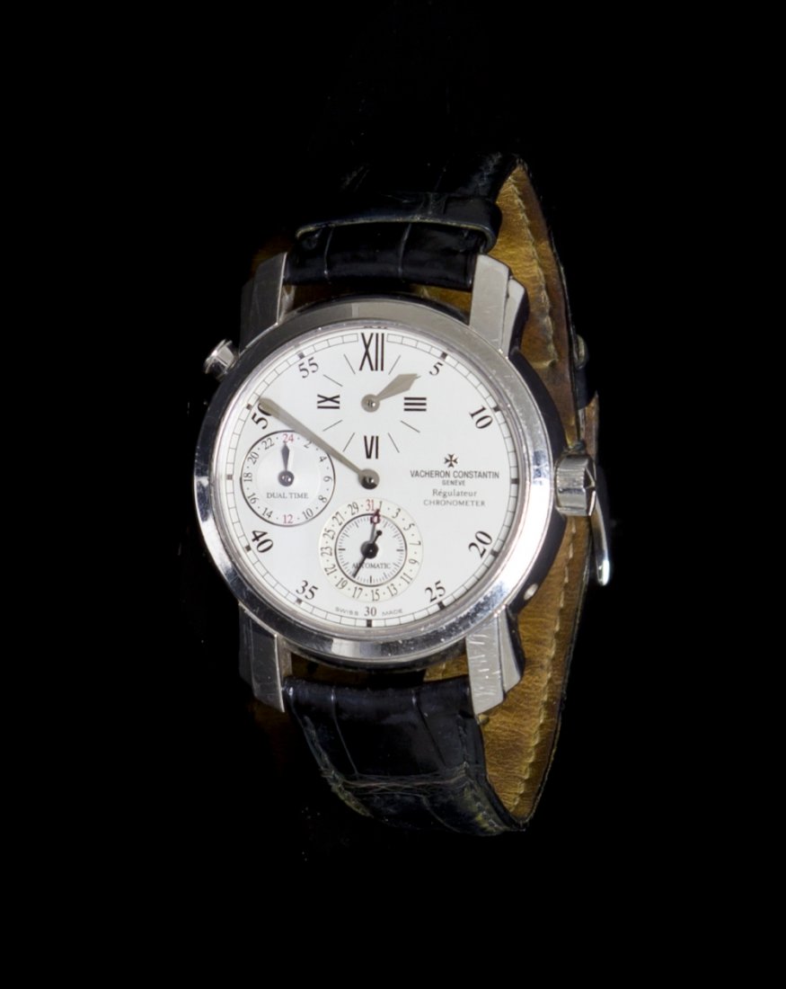 An 18 Karat White Gold Malte Dual Time Regulator Wr: An 18 Karat White Gold Malte Dual Time Regulator Wristwatch, Vacheron Constantin, 38.50 mm case diameter, silvered dial, Roman and applied silvered block numerals, outer chapter ring calibrated to 60 