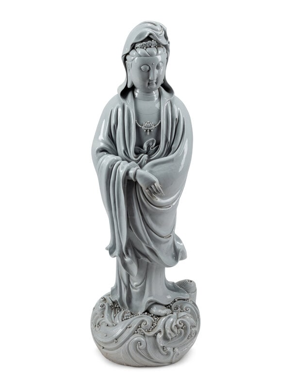 A Large Blanc de Chine Figure of Guanyin: A Large Blanc de Chine Figure of Guanyin 20th Century Height 44 inches. This lot is located in Palm Beach.