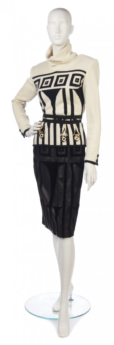 A Valentino Black and Cream Daywear Ensemble, Skirt: A Valentino Black and Cream Daywear Ensemble, comprised of a black and cream cashmere turtleneck sweater, a black leather and velvet skirt and a black suede charm belt. Labeled: Valentino Couture. Ski