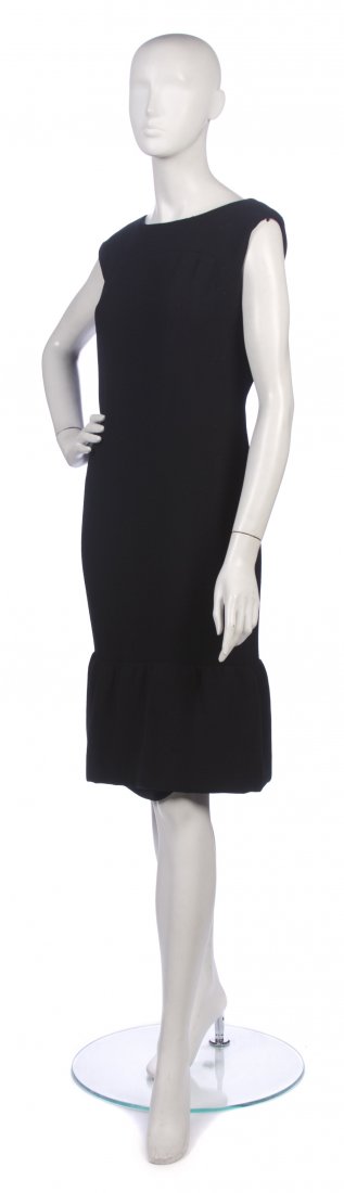 A Black Wool Crepe Dress,: A Black Wool Crepe Dress, attributed to Norman Norell, sleeveless with small flounce around bottom, has "Front" label. Unlabeled. Property from a New York City Collection