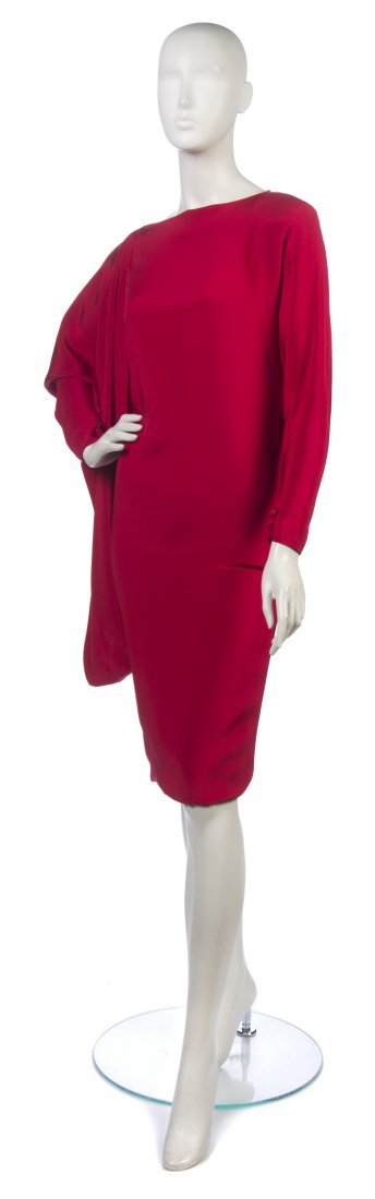 A Red Silk Cocktail Dress,: A Red Silk Cocktail Dress, attributed to Pierre Cardin, asymmetrical draped sleeve. Property from the Estate of the Marquise de Surian