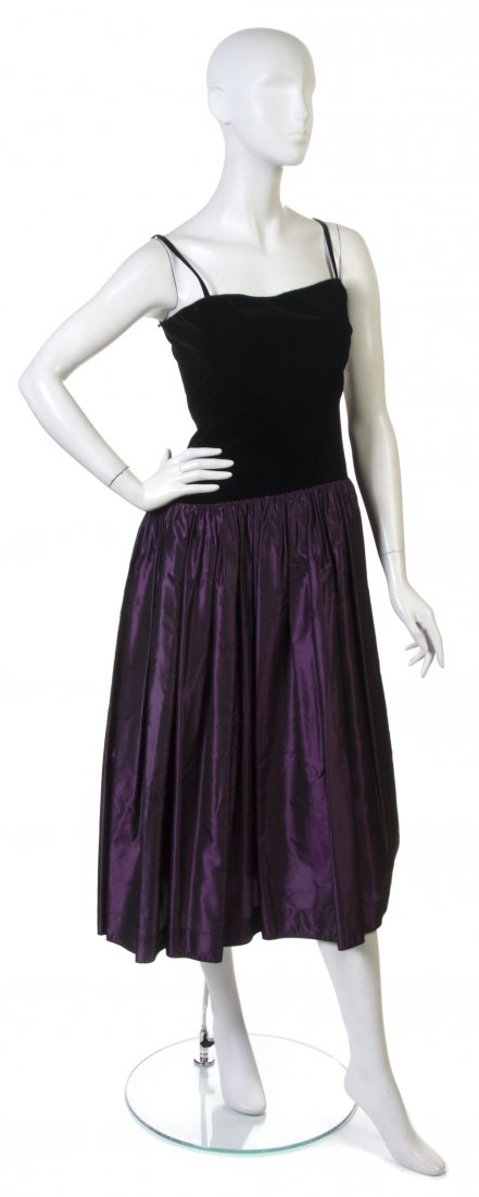 An Yves Saint Laurent Black Velvet and Purple Silk: An Yves Saint Laurent Black Velvet and Purple Silk Evening Dress. Labeled: Saint Laurent. Size 34.