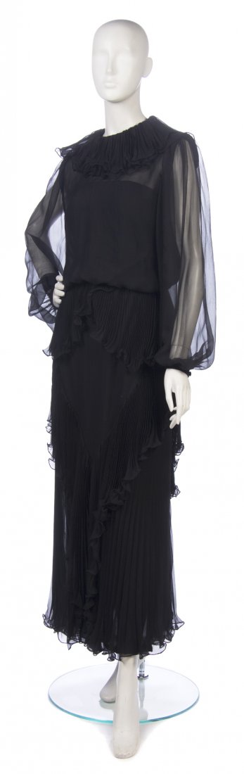 An Andre Laug Black Chiffon Evening Gown, Size 16.: An Andre Laug Black Chiffon Evening Gown, pleated ruffle tiers embellishing skirt and neckline. Labeled: Andre Laug / Martha. Size 16.