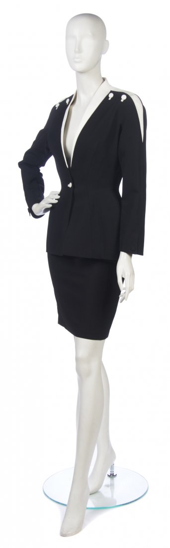 A Thierry Mugler Black Skirt Suit, Size 36.: A Thierry Mugler Black Skirt Suit, with white trim and buttons. Labeled: Thierry Mugler. Size 36. Property from a New York City Collection