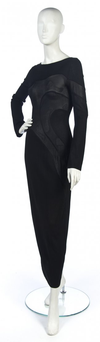 A Versace Black Knit Dress,: A Versace Black Knit Dress, sheer panelling in a swirl design. Labeled: Versace Classic V2.