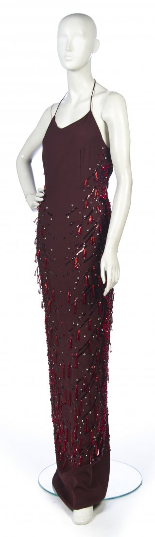 A Gucci Dark Red Silk Evening Gown,: A Gucci Dark Red Silk Evening Gown, Tom Ford for Gucci, with allover rhinestones, sequins and red bugle bead tassels. Labeled: Gucci. Property from a New York City Collection