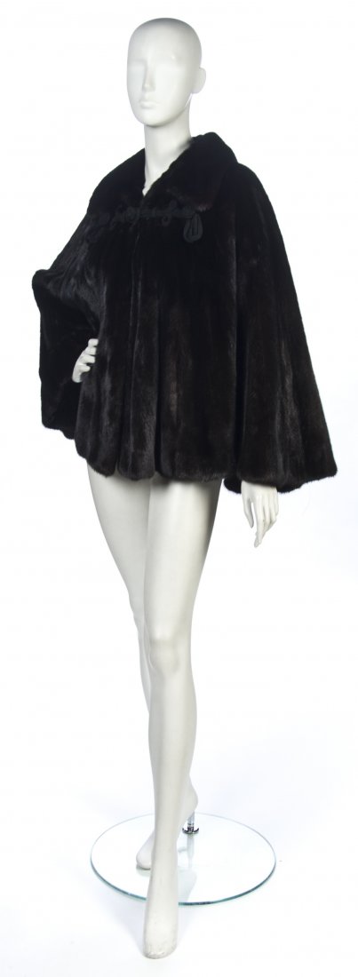 A Brown Mink Cape,: A Brown Mink Cape, with black braided silk closure. Unlabeled. Property from a Distinguished Private Collector