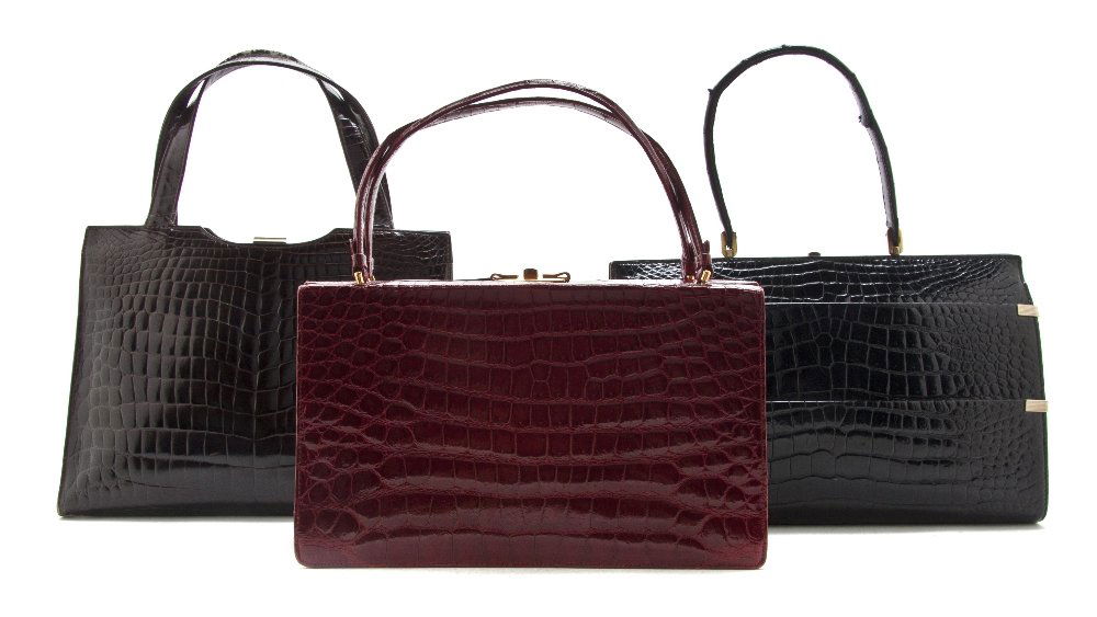 A Group of Three Crocodile Bags,: A Group of Three Crocodile Bags, comprised of a B black crocodile bag, a B. Altman red crocodile bag, and Sac Mon Paris brown faux crocodile bag. Property from a Distinguished Private Collector